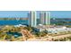Aerial view showcases condo buildings with a view of surrounding waterfront at 241 Riverside Dr # 207, Daytona Beach, FL 32117