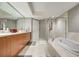 Large bathroom with wood cabinets, stone countertops, and a glass enclosed shower at 241 Riverside Dr # 207, Daytona Beach, FL 32117