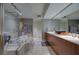 Modern bathroom features a tub, large vanity, and tile flooring at 241 Riverside Dr # 207, Daytona Beach, FL 32117