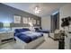Bedroom features two queen beds with blue bedding, ceiling fan and stylish decor at 241 Riverside Dr # 207, Daytona Beach, FL 32117