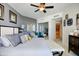 Comfortable bedroom with a king bed, ceiling fan, and access to the bathroom at 241 Riverside Dr # 207, Daytona Beach, FL 32117