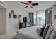 Comfortable bedroom features a king bed, ceiling fan, and large glass windows at 241 Riverside Dr # 207, Daytona Beach, FL 32117
