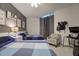 Inviting bedroom with two beds, soft lighting, and functional workspace, creating a comfortable and practical retreat at 241 Riverside Dr # 207, Daytona Beach, FL 32117