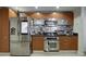 Well-equipped kitchen features stainless steel appliances, modern backsplash, and sleek cabinetry for a modern cooking experience at 241 Riverside Dr # 207, Daytona Beach, FL 32117