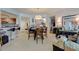 Open-concept living and dining area with a kitchen, showcasing a functional and inviting living space at 241 Riverside Dr # 207, Daytona Beach, FL 32117