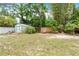 Expansive backyard featuring a shed, clothesline, lush greenery, and plenty of open space at 28 W Highbanks Rd, Debary, FL 32713
