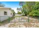 Enclosed backyard with a chain-link fence, shed, and patio area offers privacy and functionality at 28 W Highbanks Rd, Debary, FL 32713