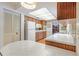 Bright kitchen offering wraparound countertops, white appliances, wood cabinetry and a cheerful breakfast nook at 28 W Highbanks Rd, Debary, FL 32713