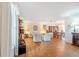 Bright and airy living room with hardwood floors, large windows, and neutral decor at 28 W Highbanks Rd, Debary, FL 32713