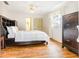 Spacious main bedroom with closet, dresser, ceiling fan and wood flooring at 28 W Highbanks Rd, Debary, FL 32713