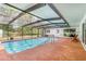Enclosed pool featuring a patio, seating, and a well-maintained exterior at 28 W Highbanks Rd, Debary, FL 32713