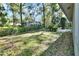 The backyard has lush greenery and tall trees, providing a private and serene outdoor space at 29 Ramblewood Trl, Deland, FL 32724