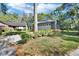 Charming home with a stone-accented garage and a well-manicured front yard with beautiful landscaping at 29 Ramblewood Trl, Deland, FL 32724