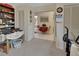 Hallway with two closets, an eating area, and a table with books and miscellaneous items at 29 Ramblewood Trl, Deland, FL 32724