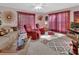 Spacious living room featuring comfortable seating, ample natural light, and a stylish rug, creating a relaxing atmosphere at 29 Ramblewood Trl, Deland, FL 32724