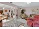 Comfortable living room with a plush sofa, cozy armchairs, and an open floor plan leading to the dining area at 29 Ramblewood Trl, Deland, FL 32724