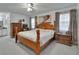 Spacious main bedroom featuring a light wood four poster bed and decorative accents at 29 Ramblewood Trl, Deland, FL 32724