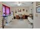 Office featuring two desks, a rolling chair, a ceiling fan, and natural light at 29 Ramblewood Trl, Deland, FL 32724