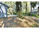A large patio area offers an ideal space for entertaining, with greenery and trees creating a peaceful backyard at 29 Ramblewood Trl, Deland, FL 32724