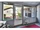 Bright sunroom featuring multiple windows with outdoor views, offering a peaceful and relaxing space at 29 Ramblewood Trl, Deland, FL 32724