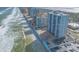 Aerial view of a beachfront property with condos, pools, and beautiful ocean views at 3003 S Atlantic Ave # 19B4, Daytona Beach, FL 32118