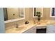 Well-lit bathroom with double sink vanity, large mirrors, and modern fixtures at 3003 S Atlantic Ave # 19B4, Daytona Beach, FL 32118