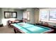 Well-lit community billiard room with multiple game tables and seating at 3003 S Atlantic Ave # 19B4, Daytona Beach, FL 32118