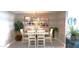 Inviting dining area with modern chandelier and stylish table setting, perfect for entertaining at 3003 S Atlantic Ave # 19B4, Daytona Beach, FL 32118