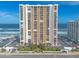 Stunning exterior of a beachfront condo building with ocean views and ample parking at 3003 S Atlantic Ave # 19B4, Daytona Beach, FL 32118
