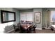 Game room featuring a round table with chairs, pool cues, and a window for natural light at 3003 S Atlantic Ave # 19B4, Daytona Beach, FL 32118