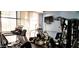 Bright community gym equipped with modern treadmills, ellipticals, weight machines and mounted television at 3003 S Atlantic Ave # 19B4, Daytona Beach, FL 32118
