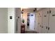 Hallway leading into unit with decorative decor and unit information displayed at 3003 S Atlantic Ave # 19B4, Daytona Beach, FL 32118