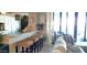 Living room with bar seating and access to balcony featuring beautiful furnishings at 3003 S Atlantic Ave # 19B4, Daytona Beach, FL 32118