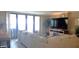 Bright and airy living room with large windows, comfortable seating and entertainment area at 3003 S Atlantic Ave # 19B4, Daytona Beach, FL 32118