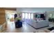 Open living area with neutral tile floors, comfortable seating and adjacent dining area at 3003 S Atlantic Ave # 19B4, Daytona Beach, FL 32118