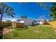 Wide view of the backyard with newly stained fence at 302 Lafayette St, Port Orange, FL 32127