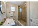 Bathroom with sink and walk-in shower featuring glass door at 302 Lafayette St, Port Orange, FL 32127