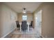 Bright dining area features a modern table and stylish ceiling fan at 302 Lafayette St, Port Orange, FL 32127