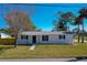 Inviting single-story home with a well-maintained lawn, offering a classic and comfortable curb appeal at 302 Lafayette St, Port Orange, FL 32127