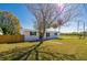 Single-story home with a well-manicured lawn, featuring a shade tree and a welcoming curb appeal at 302 Lafayette St, Port Orange, FL 32127