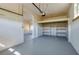 Spacious garage with overhead storage and shelving at 302 Lafayette St, Port Orange, FL 32127