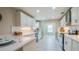 Modern kitchen features stainless steel appliances and white cabinets at 302 Lafayette St, Port Orange, FL 32127