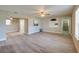 Stylish living room with wood-look flooring, neutral walls, and an open layout, perfect for modern living at 302 Lafayette St, Port Orange, FL 32127
