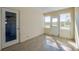 Sunroom with tile floors and lots of natural light from the glass doors and windows at 302 Lafayette St, Port Orange, FL 32127