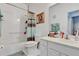 Bathroom featuring a tub/shower combo with a vanity and mirror at 307 Heron Point Way, Deland, FL 32724