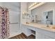 Bathroom showcasing a spacious vanity with a built-in makeup area and a walk-in shower with accessibility features at 307 Heron Point Way, Deland, FL 32724