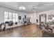 Bright living room with hardwood floors and plantation shutters, perfect for relaxing or entertaining at 307 Heron Point Way, Deland, FL 32724