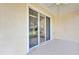 Covered patio featuring tile flooring and sliding glass doors leading into the home at 307 Heron Point Way, Deland, FL 32724