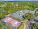 Community tennis and pickleball courts, with a parking lot and wooded area, perfect for fitness and relaxation at 307 Heron Point Way, Deland, FL 32724