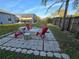 Backyard area with a fire pit area and a screened in pool at 3209 S Dorchester Dr, Deltona, FL 32738